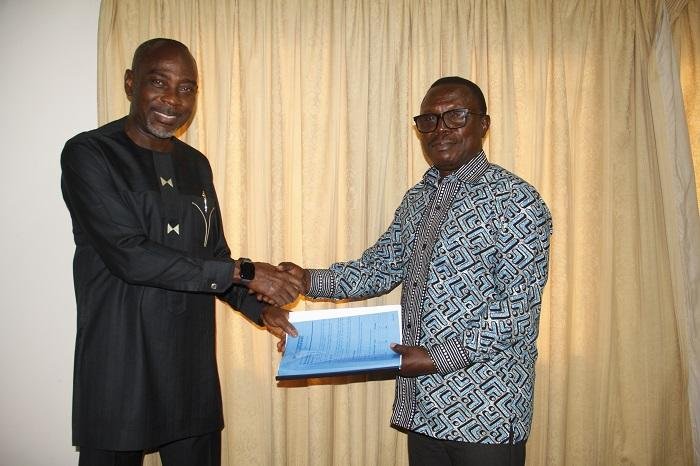 Mr Martin Adu-Owusu (right) handing over the document to Prof. Kwamena Kwansah -Aidoo