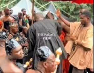 Traditional priest performing rites at the funeral grounds