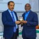 Mr Richard Akpokavie receiving his medal from Mr. Tayyab Ikram