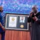 Prophet Eric Boahen recieving the citation of honour from the CEO of GMA-USA, Mr Dennis Boafo