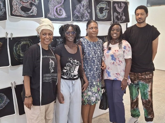 Claudia George, (first from right) in a group photograph with patrons at the event