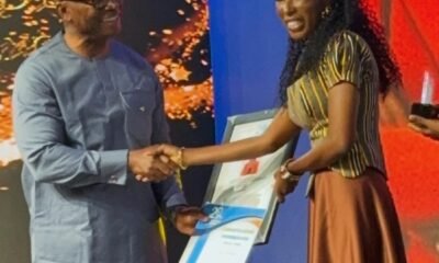 -Ms Abigail Annoh (right) of The Ghanaian Times receiving her award