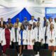 • The students with some officials of the school in a group photograph