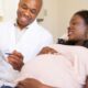 A pregnant woman in a chat with a doctor