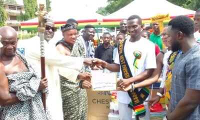 Alhaji Faila (second from left) presenting the items to Mr Kotei, La Nkwantanang-Madina Municipality best farmer