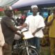 Mr Francis Dufe (Third from left) presenting a certificate to the best farmer