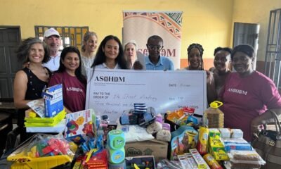 Mrs Malika Mene and Mrs Sovanna Taliercio and their members present the items to Ataa Lartey