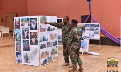 • Some military officers admiring some photos