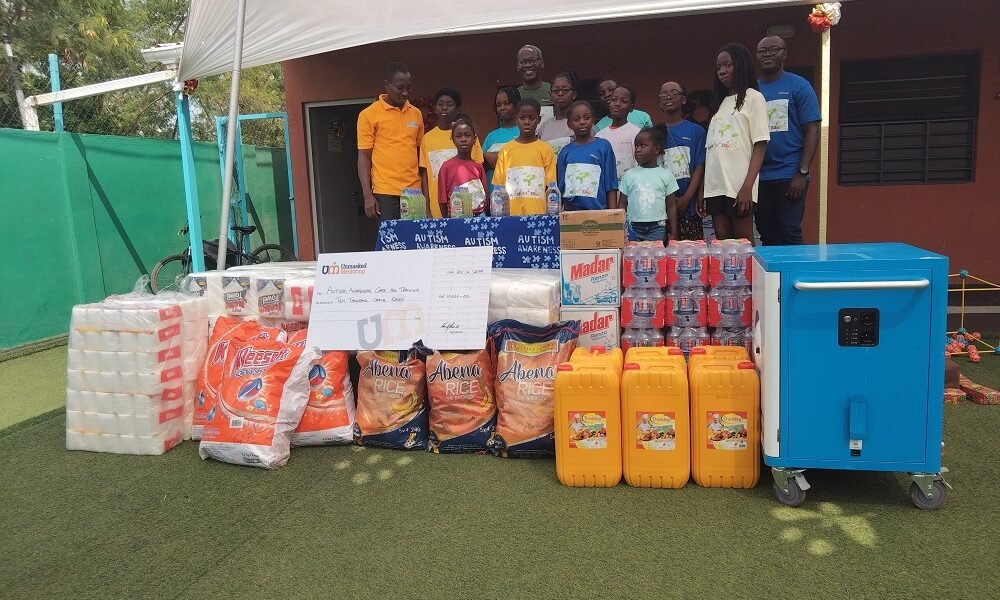 • Members of Unmasked Mentoring and Mr Grant (left) in a group picture after the presentation