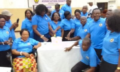 Members cutting the anniversary cake