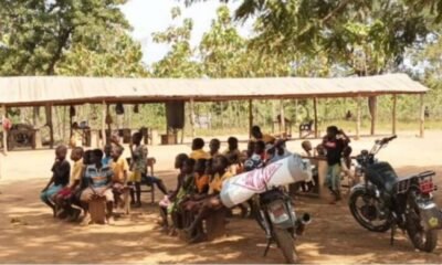 Some students of Mokota seated under a tree