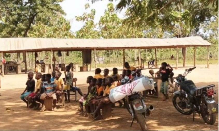 Some students of Mokota seated under a tree