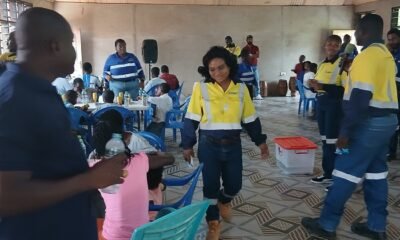 Staff of UMA and ROPEAK serving the children of Compassion Is Love In Action orphanage