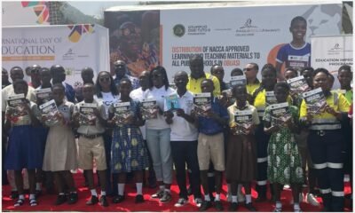 Students in a group photograph with organisers