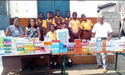• The donors and Ataa Lartey (right) with some of the school children after the donation