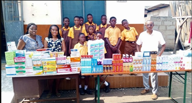 • The donors and Ataa Lartey (right) with some of the school children after the donation