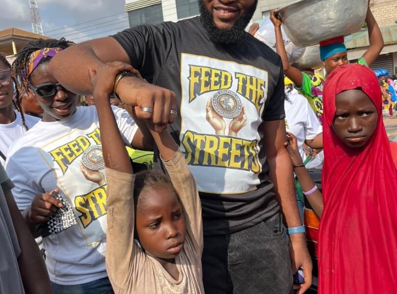 Mr Godwim Oppong Danso ( Coordinator) with some of the streat children