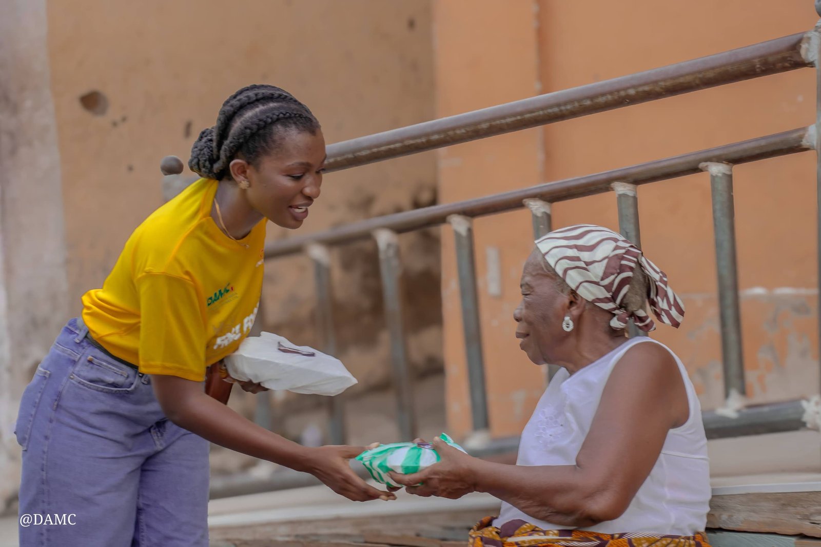 • Ms Lartey presenting a package to a beneficiary