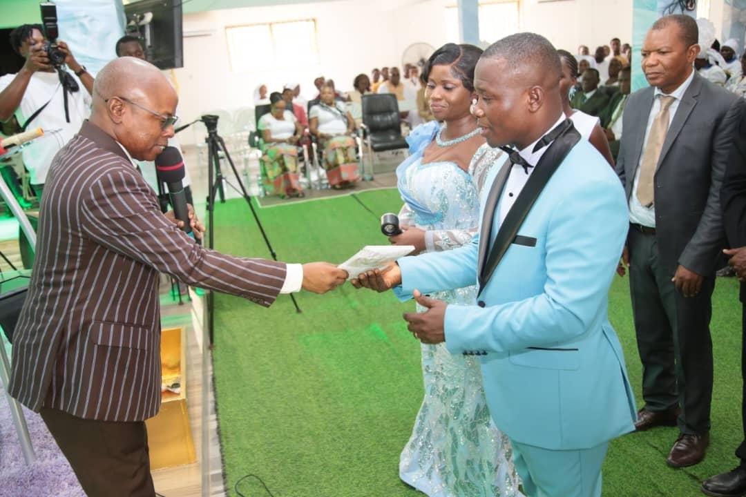 Rev Smith (right) receiving a document from Rev Anthony Ampah during the programme
