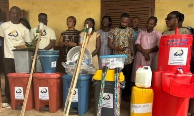 Some officials with some of the items presented to the schools