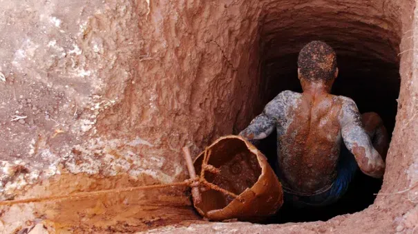 Student in a galamsey pit