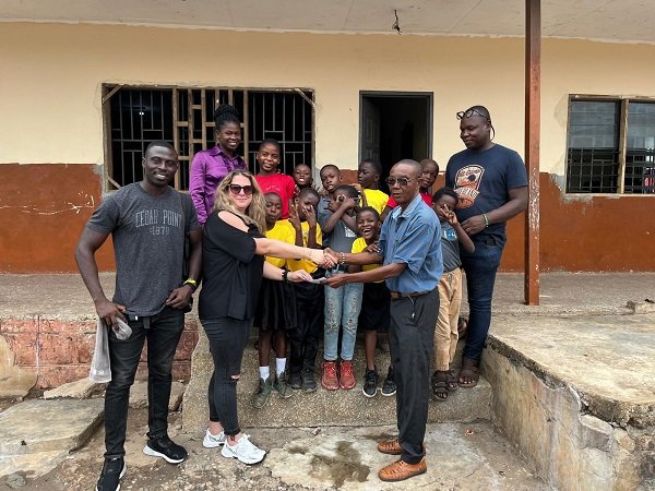 The founder of Street Academy recieving the items