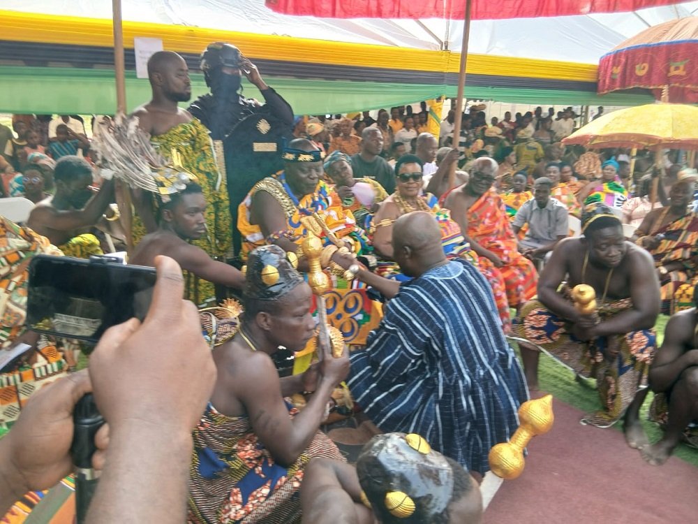 Ahmed Ibrahim exchanging pleasantaries with the chief