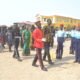 Mr Anyetei (right) being assisted by Ms Sowah (second row, second from left) and Ms Kotomah (third row, left) to inspect the parade Photo Victor A. Buxton