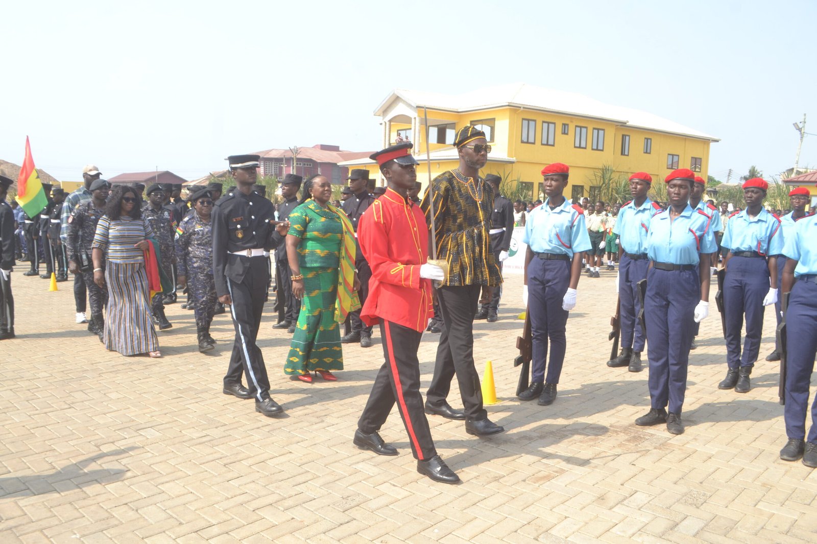 Mr Anyetei (right) being assisted by Ms Sowah (second row, second from left) and Ms Kotomah (third row, left) to inspect the parade Photo Victor A. Buxton