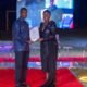Mr Pobee presenting an award to one of the awardees
