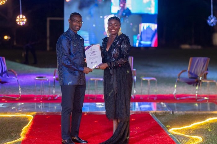 Mr Pobee presenting an award to one of the awardees