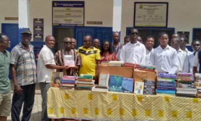 Rev Fr. Ben Ohene Opoku (third left) receiving the items on behalf of the students from Mr Duodu Adjei.