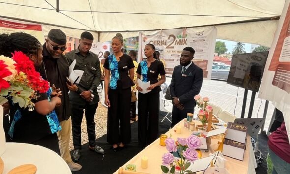 Director-General of the National Sports Authority (NSA), Yaw Ampofo Ankrah assessing the work of some students