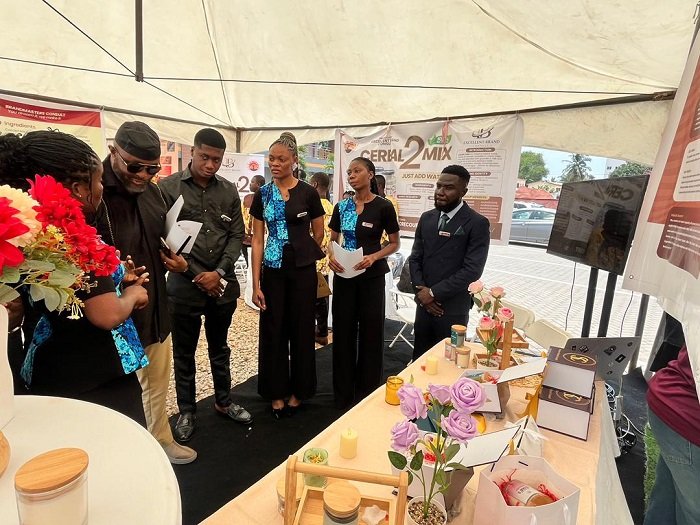 Director-General of the National Sports Authority (NSA), Yaw Ampofo Ankrah assessing the work of some students
