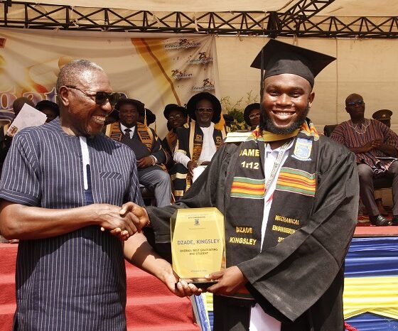 Dr. Clement Abas Apaak [left] presenting the Overall best student award to master Dzade Kingsley.Photo Okai Elizabeth.