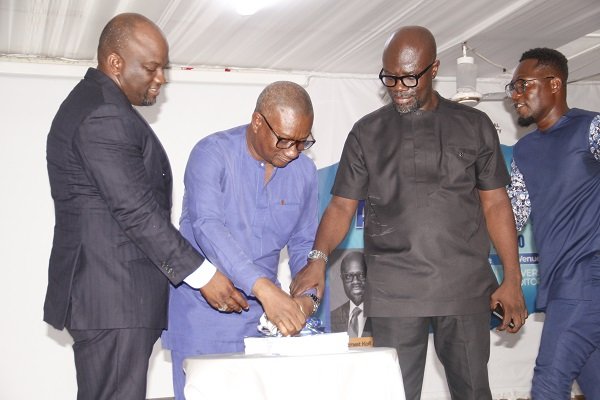 Dr.Newman [middle] being assited by Prof Abotsi [second from right] and Prof Acakpovi [left] to launched the Strategic Plan document photo Okai Elizabeth