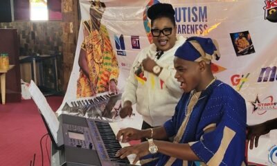 Mrs Bertino (left) supporting his ward, Young Phil to play the piano