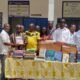Rev. Fr. Ben Ohene Opoku (third left) receiving the items on behalf of the students from Mr Duodu Adjei