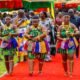 A group of adowa dancers entertaining guests