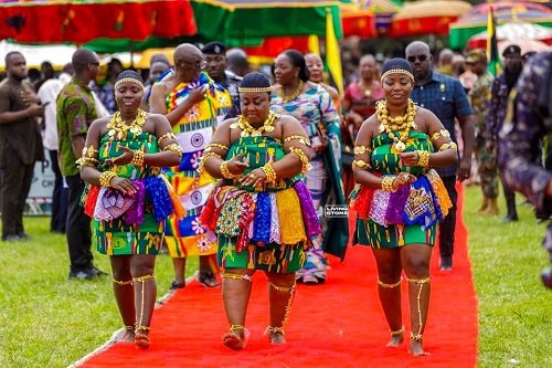 A group of adowa dancers entertaining guests