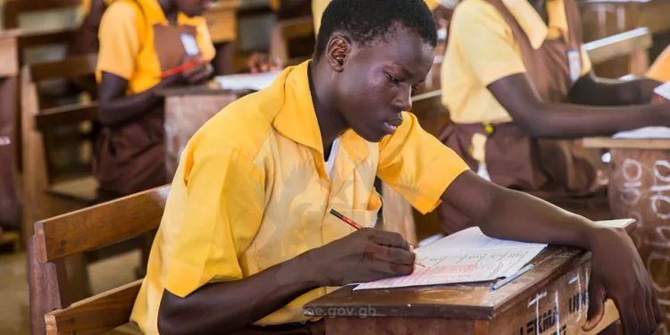 A pupil of government school wirting exams
