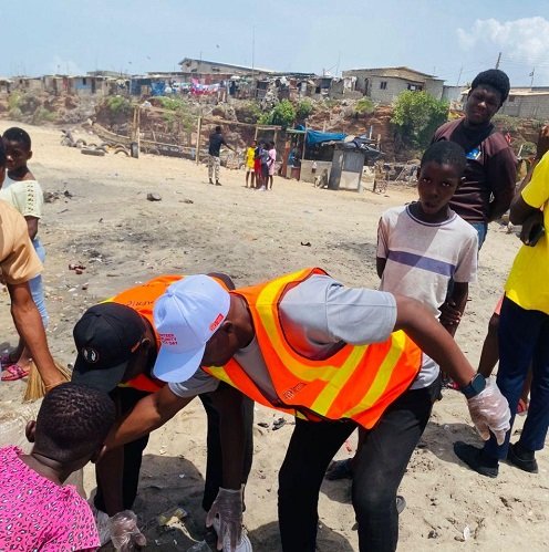Members of the two instutions cleaning the beach