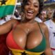 An excited fan cheering the Black Stars