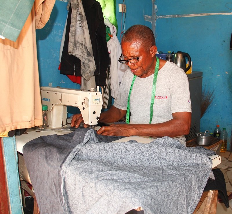 Chidi Peter Igwe Okenyi sewing a shirt