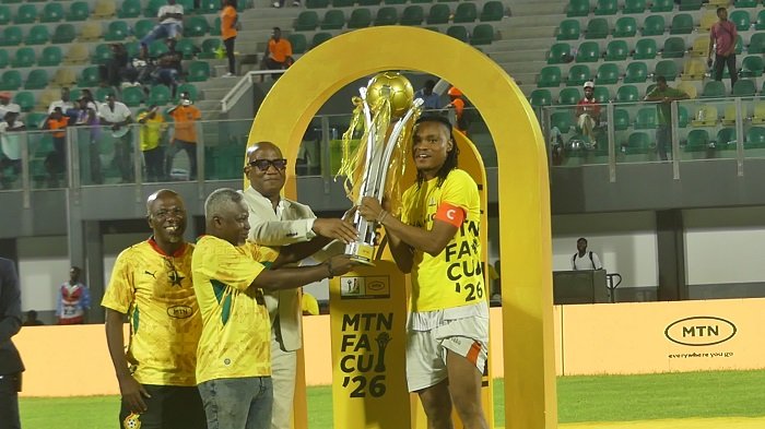 GFA Vice President, Mark Addo and FA Cup officials present the trophy to skipper Razak Simpson