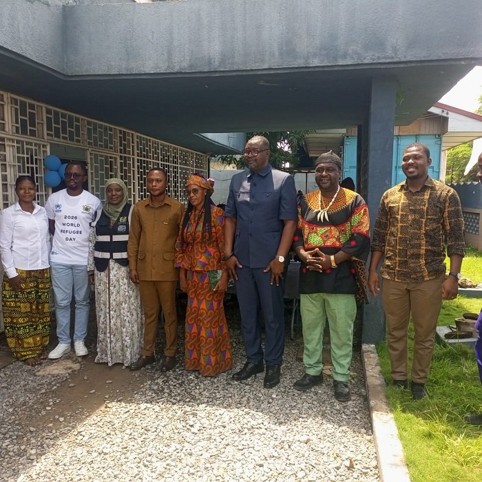 Mr Bediako (third from right) and Mr Azumah (fourth from right) with some refugees and executives of the Ghana Refugee Board