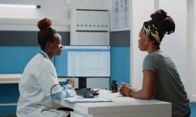 A doctor in a consulting room with her patient