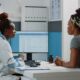 A doctor in a consulting room with her patient