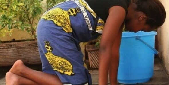 A househelp cleaning the floor