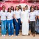 Dede Ayew flanked by the Miss Ghana contestants